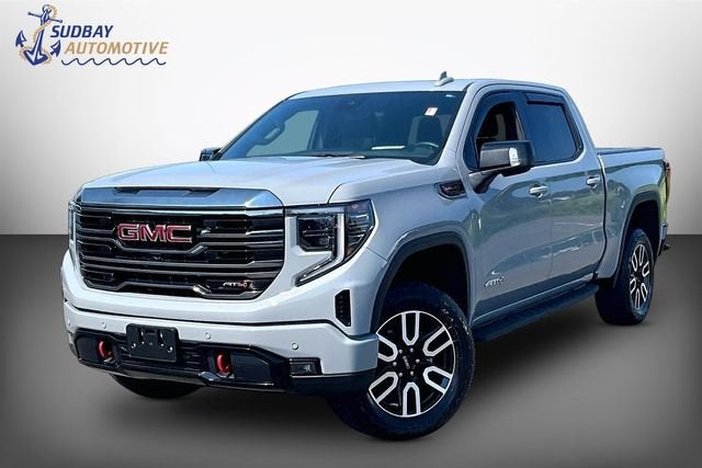 2024 GMC Sierra 1500 AT4 in Thunderstorm Gray — front three-quarter view