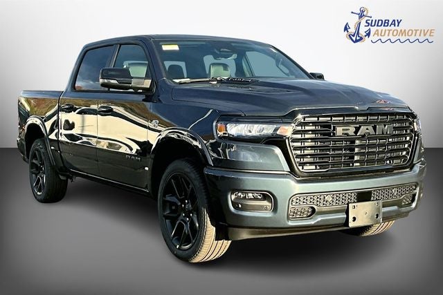 2026 RAM 1500 Laramie in Forged Blue Metallic — front three-quarter view